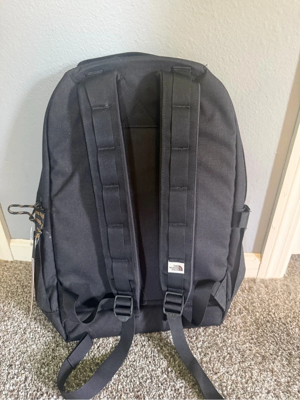 The North Face Black Backpack with Brown Patch